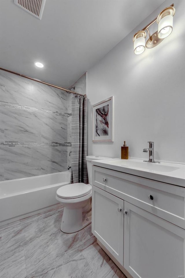 full bathroom with shower / tub combo, vanity, and toilet