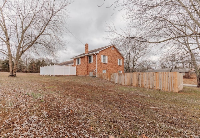 view of property exterior with central AC