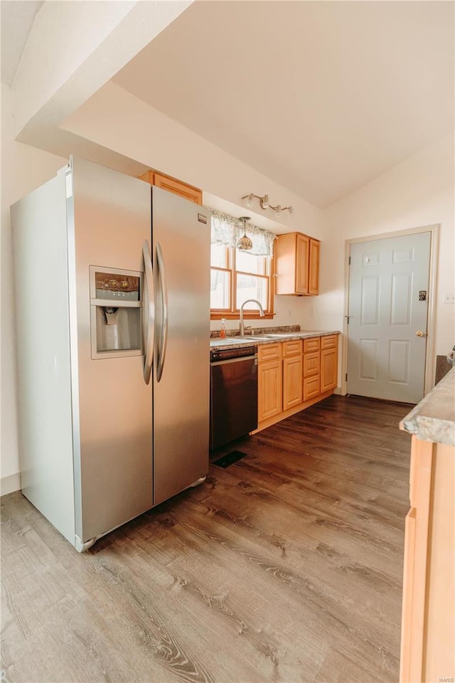 kitchen with stainless steel refrigerator with ice dispenser, light brown cabinetry, sink, light hardwood / wood-style flooring, and dishwasher