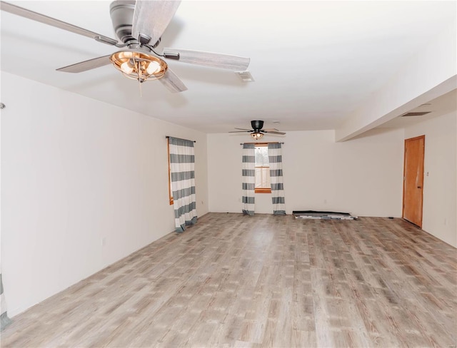 unfurnished living room featuring light wood-type flooring