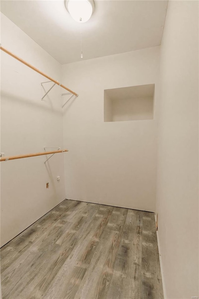 spacious closet featuring hardwood / wood-style floors