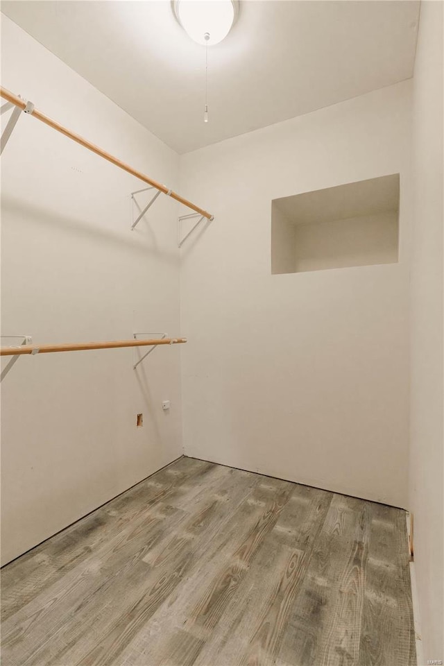 spacious closet featuring hardwood / wood-style floors