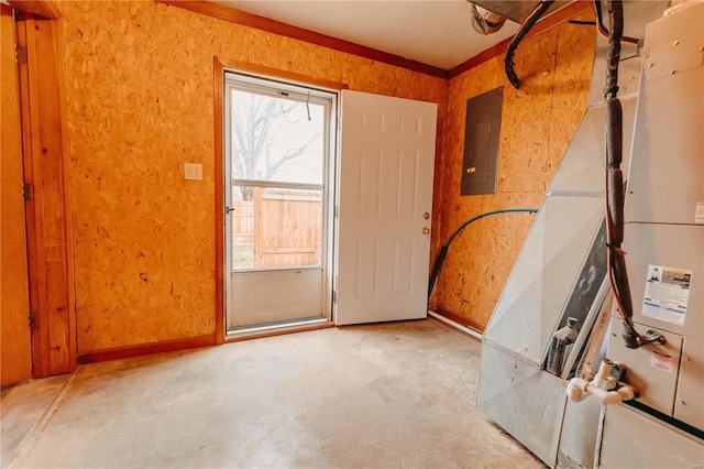 entryway with concrete flooring and electric panel