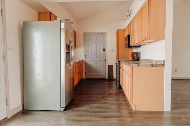 kitchen with light brown cabinetry, lofted ceiling, hardwood / wood-style flooring, fridge with ice dispenser, and electric stove