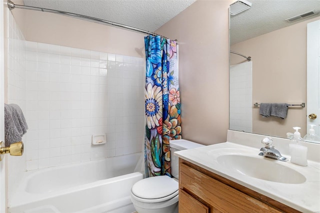 full bathroom with a textured ceiling, toilet, shower / bath combo, and vanity