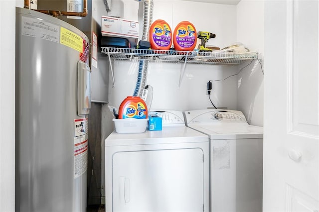 laundry room with water heater and independent washer and dryer