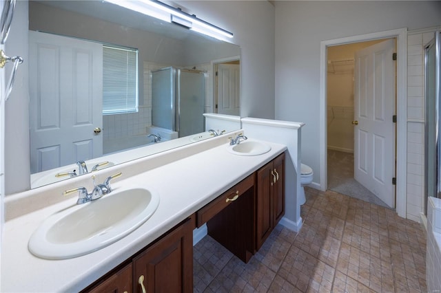 full bathroom featuring toilet, vanity, and separate shower and tub