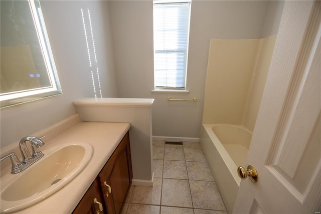 bathroom featuring tile patterned flooring and vanity