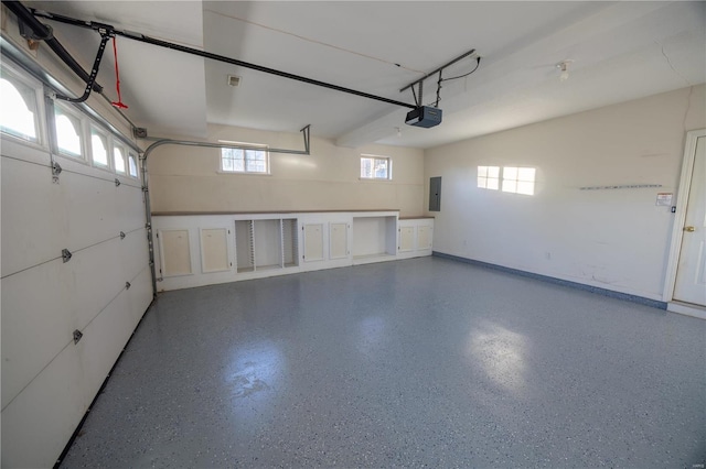 garage with electric panel and a garage door opener