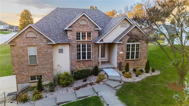 view of front of house with a yard