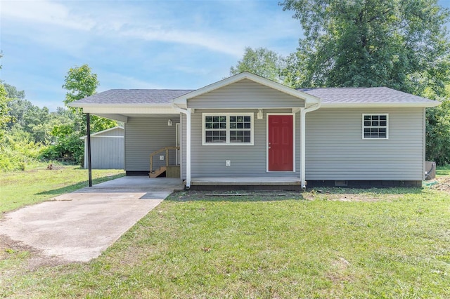 single story home featuring a carport and a front lawn