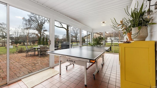 rec room featuring tile patterned floors and a wealth of natural light