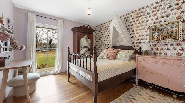 bedroom with light wood-type flooring