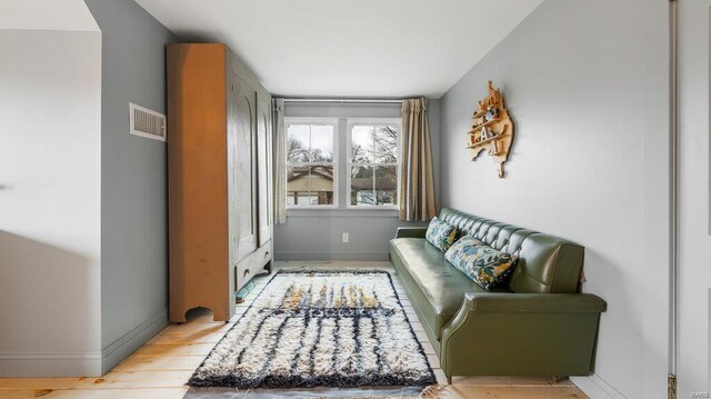 sitting room featuring light hardwood / wood-style flooring