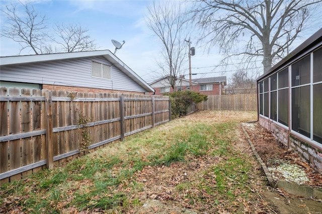 view of yard featuring a sunroom