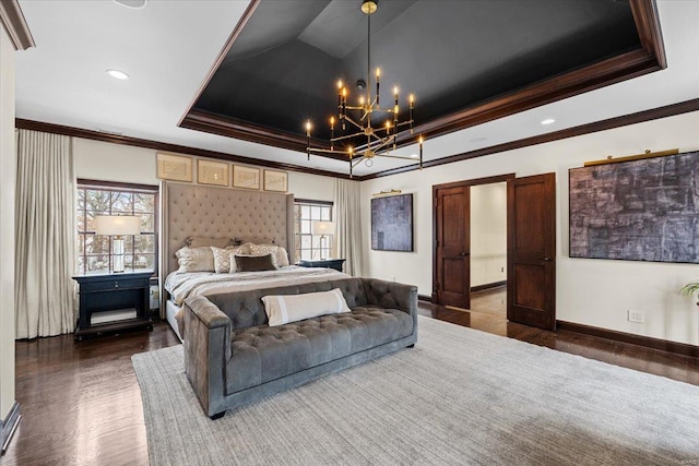 bedroom with multiple windows, crown molding, dark hardwood / wood-style flooring, and a raised ceiling