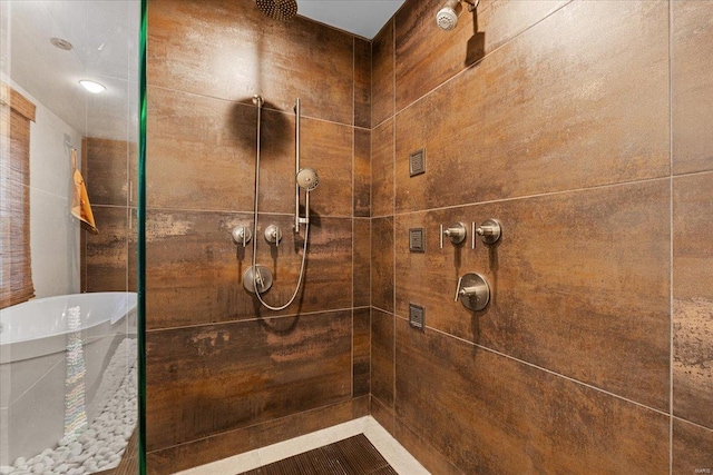 bathroom with tiled shower