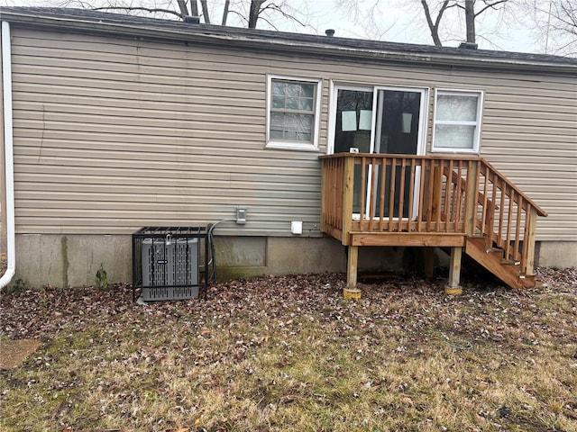 back of property featuring central air condition unit