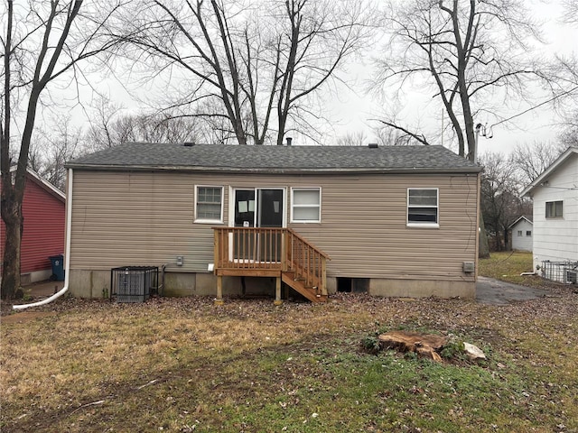 rear view of house with central AC