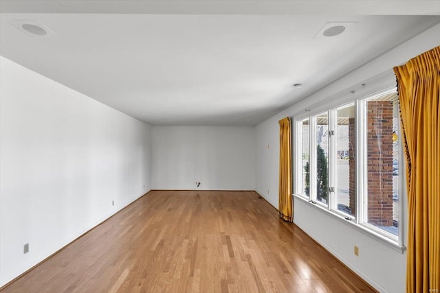 unfurnished room featuring light wood-type flooring