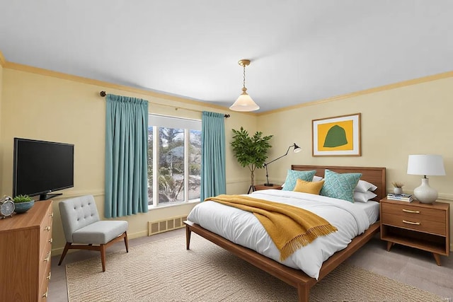 bedroom with visible vents, crown molding, and light carpet