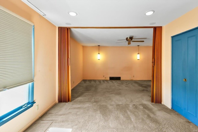 spare room with carpet, visible vents, ceiling fan, and recessed lighting