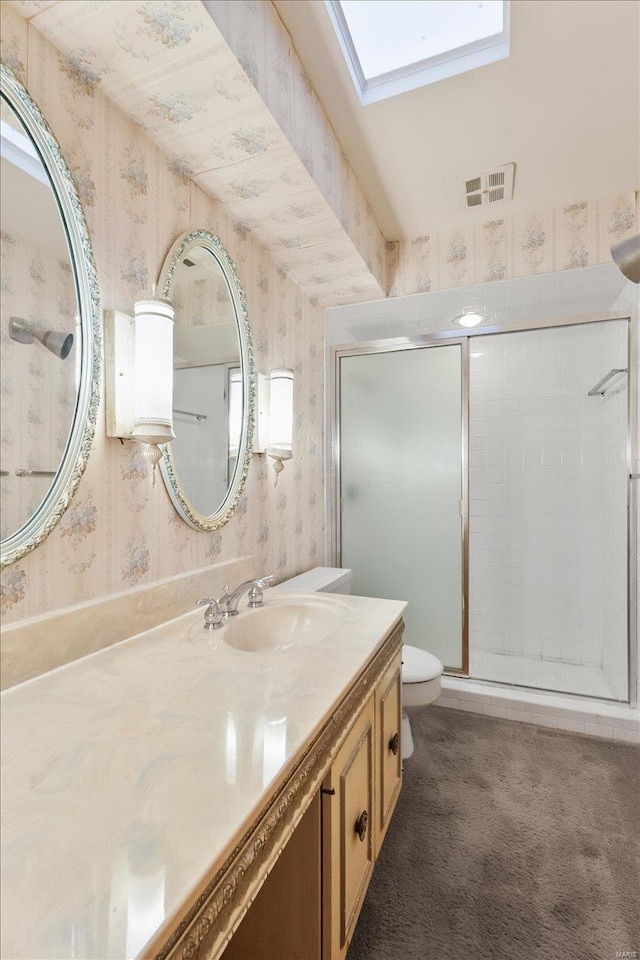 bathroom with wallpapered walls, visible vents, toilet, vanity, and a shower stall