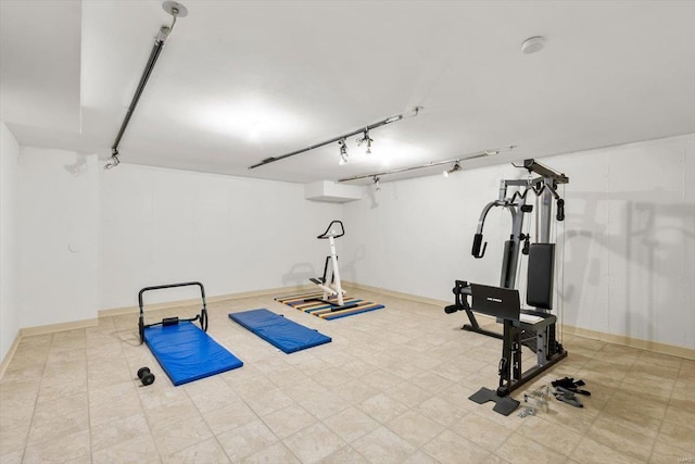 workout room with rail lighting