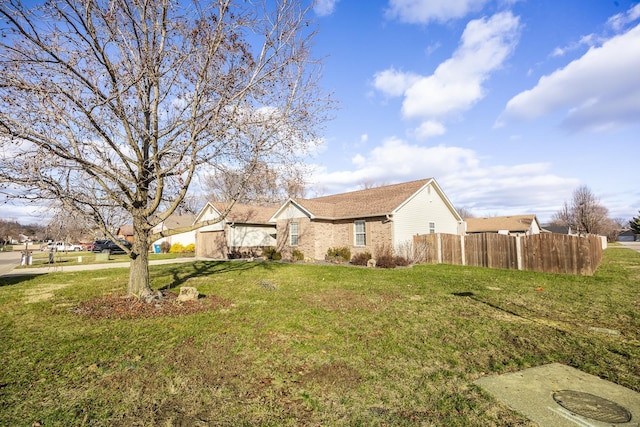 single story home with a front yard