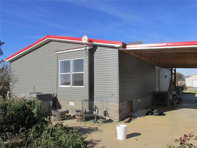 view of property exterior with a patio area and cooling unit