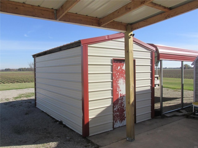 view of outdoor structure featuring a rural view