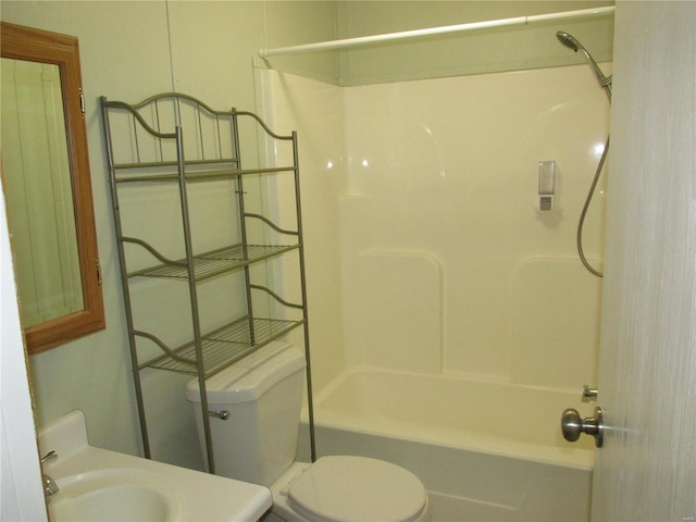 full bathroom featuring toilet, washtub / shower combination, and vanity