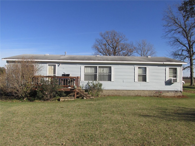 rear view of house with cooling unit, a deck, and a yard