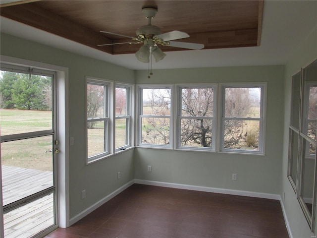 unfurnished sunroom with ceiling fan and wood ceiling