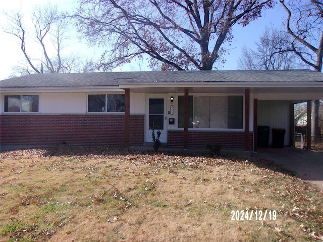 ranch-style house with a carport