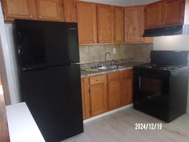 kitchen with sink, tasteful backsplash, and black appliances