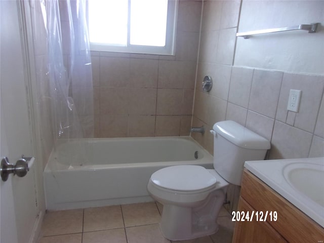 full bathroom featuring shower / bath combo, tile patterned floors, vanity, tile walls, and toilet