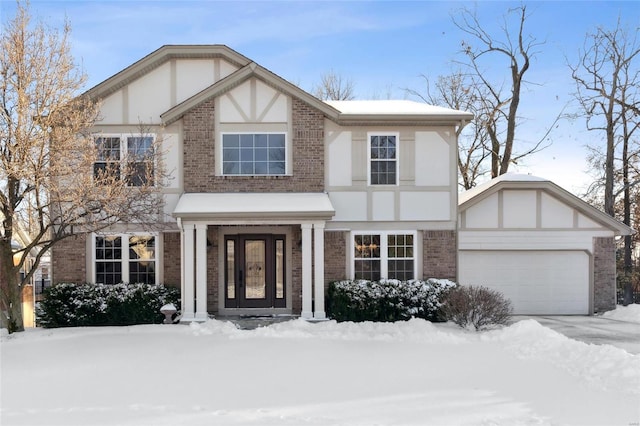 tudor-style house with a garage