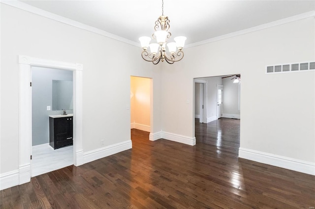 unfurnished dining area with crown molding, dark wood-type flooring, and ceiling fan with notable chandelier