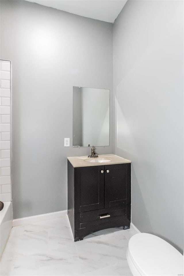 bathroom with vanity and toilet