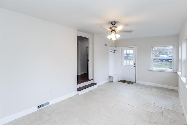 unfurnished room with ceiling fan