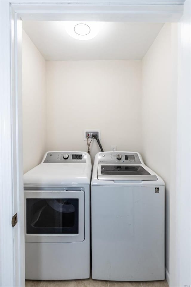 laundry room featuring washing machine and clothes dryer