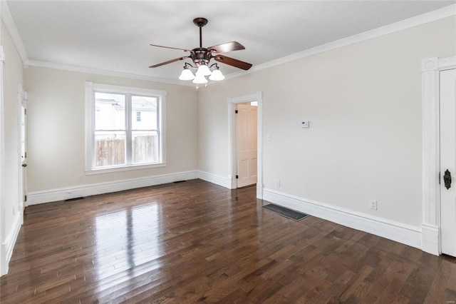 unfurnished room featuring dark hardwood / wood-style floors, ceiling fan, and ornamental molding