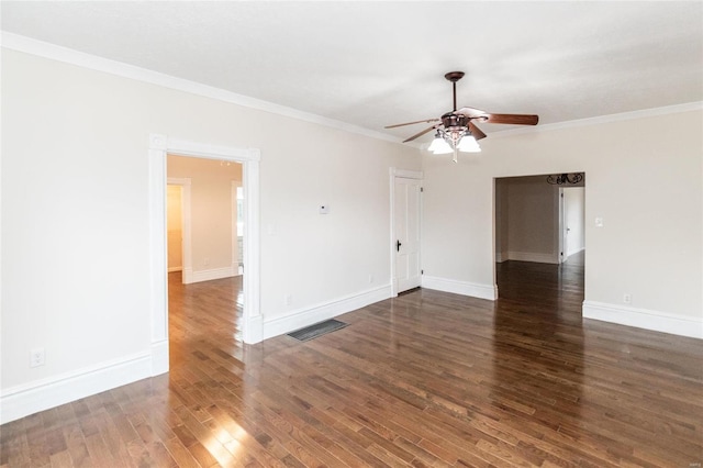 spare room with ceiling fan, dark wood-type flooring, and ornamental molding