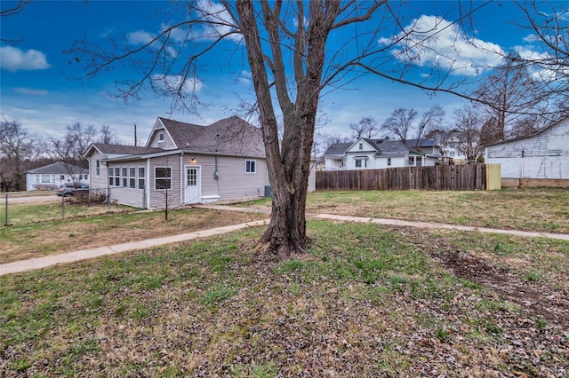 view of home's exterior with a lawn