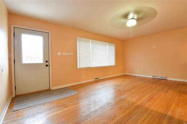 entryway with light hardwood / wood-style flooring and ceiling fan