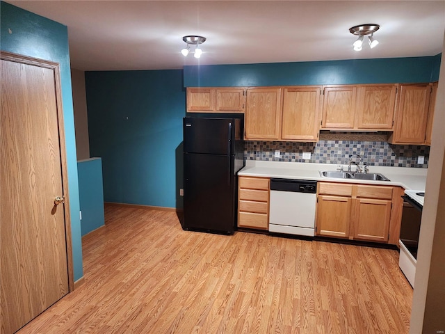 kitchen featuring backsplash, white appliances, sink, and light hardwood / wood-style flooring