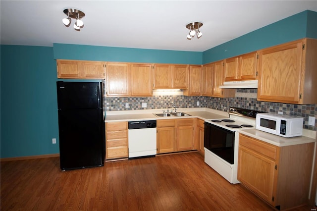 kitchen featuring sink, dark hardwood / wood-style flooring, white appliances, decorative backsplash, and light brown cabinetry