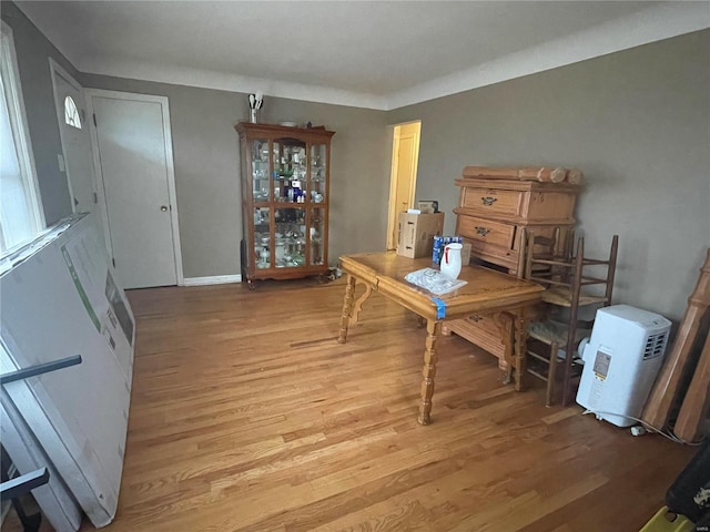 dining area featuring light wood-type flooring