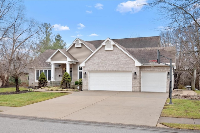 view of front of house featuring a garage and a front lawn